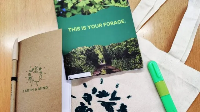 Foraging kit including a Earth & Mind branded tote bag, a foraging book, highlighter pen, notebook and pen, and foraging booklet.